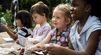 Children smile on a school field trip